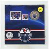 Image 1 : 2014 Edmonton Oiiler 25 Cents. Colourized. Includes 2 Stamps. Housed in its original unopened RCM fo