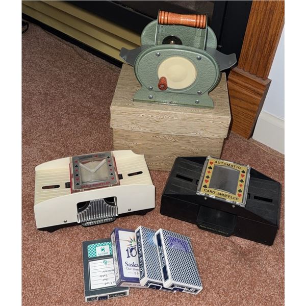 Three Card Shufflers and Four Decks of Playing Cards