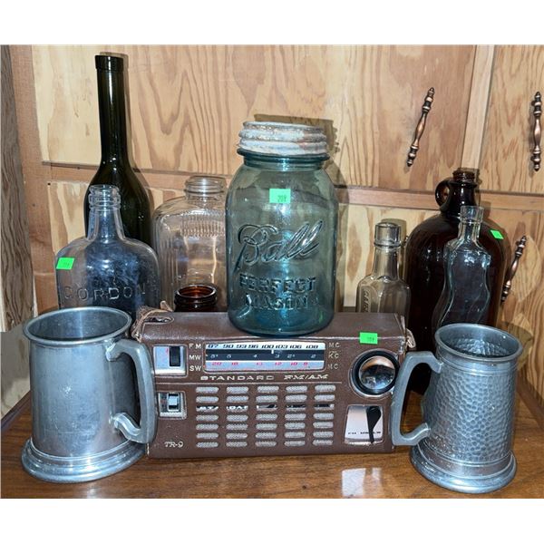 Standard FM/AM TR-9 Portable Radio, Ball Mason Jar, and Assorted Bottles