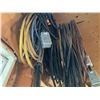 Image 3 : Extension Cords, Electrical Cables, Hose, and Chain Hanging From Wall