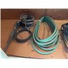 Image 4 : Extension Cords, Electrical Cables, Hose, and Chain Hanging From Wall