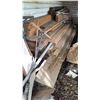 Image 2 : Building Materials and Tools Under Compound Including Wheelbarrow, Lumber, Pipes