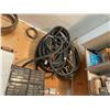 Image 1 : Wood Shop Wall-Mounted Lot with Hoses, Sump Pump, Chains, Wires and Rope