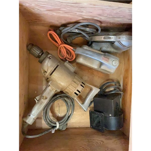 Four Electric Power Tools Including Drill, Two Sanders, and Blower