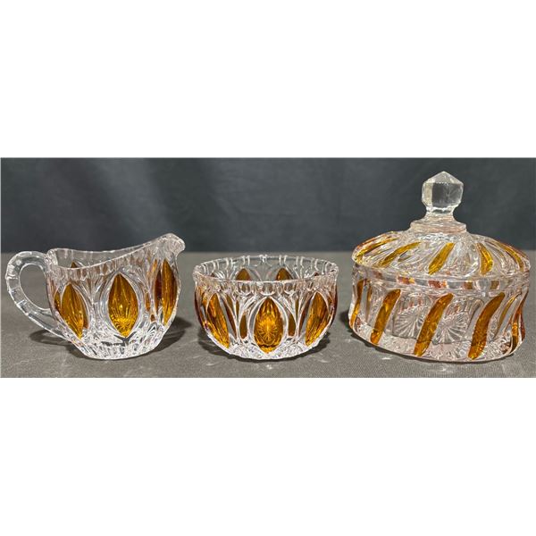 Pressed Glass Creamer, Sugar Bowl, and Lidded Dish with Amber Accents