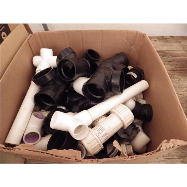 Box of ABS and PVC pipe fittings