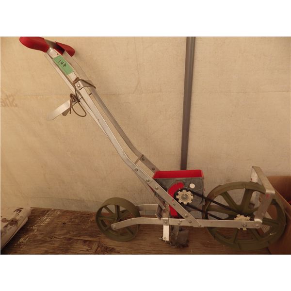 portable hand-pushable garden seed planter