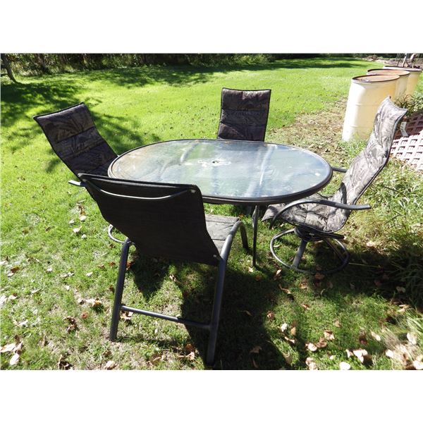 Oval glass topped patio table and 4 chairs