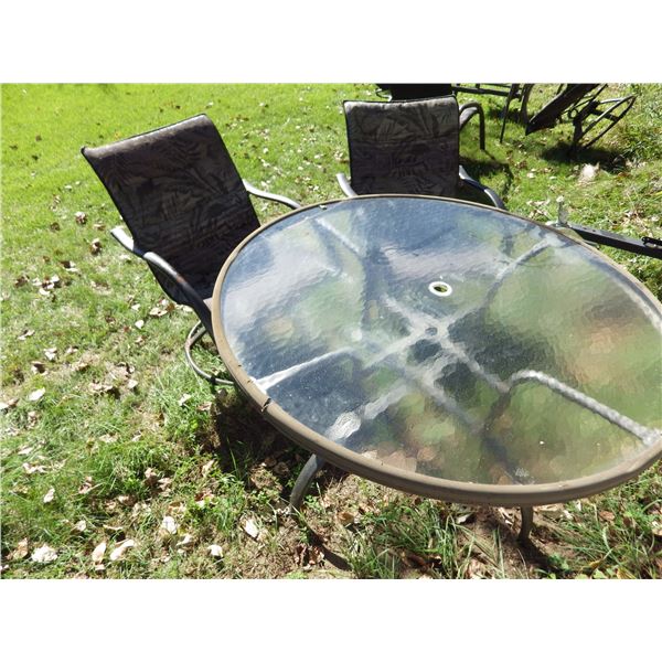 round glass topped patio table and 2 chairs