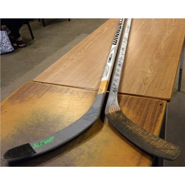 2 HOCKEY STICKS (SOME SIGNATURES)