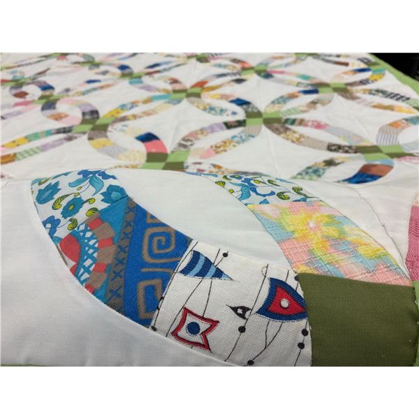 Handmade Double Wedding Ring Quilt with Multicoloured Patchwork and Green Border
