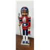 Image 5 : Christmas Lot with Blue-Eyed Santa Doll, Decorative Hockey Nutcracker, Santa and Snowman Candles
