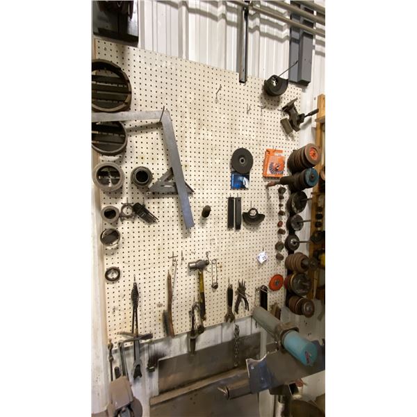 PEG BOARD WITH CONTENTS. GRINDING DISCS, SET SQUARES, HAMMERS, AS SHOWN IN PHOTO