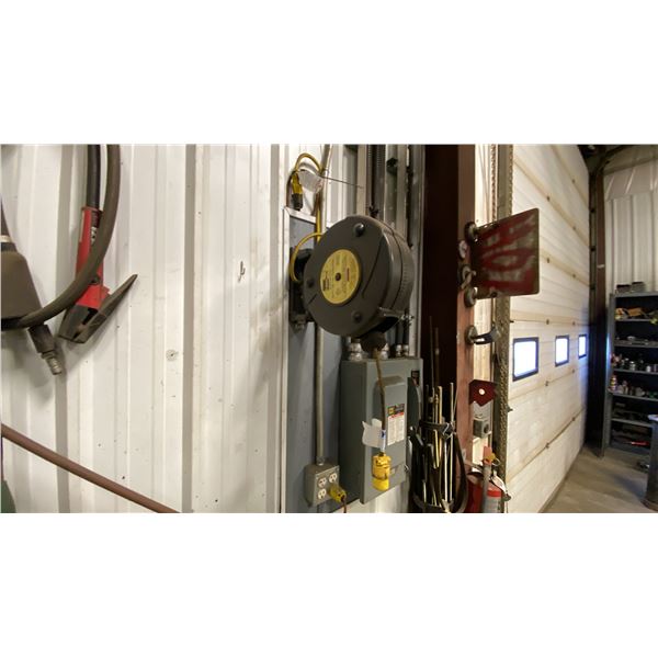 RETRACTABLE EXTENSION CORD-APPROX 50'. BUYER TO REMOVE FROM WALL