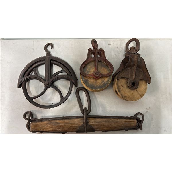 VTG CAST IRON WELL PULLEY, ANTIQUE WOOD & IRON WHIFFLETREE YOKE & (2) ANTIQUE HAY LOFT PULLEYS