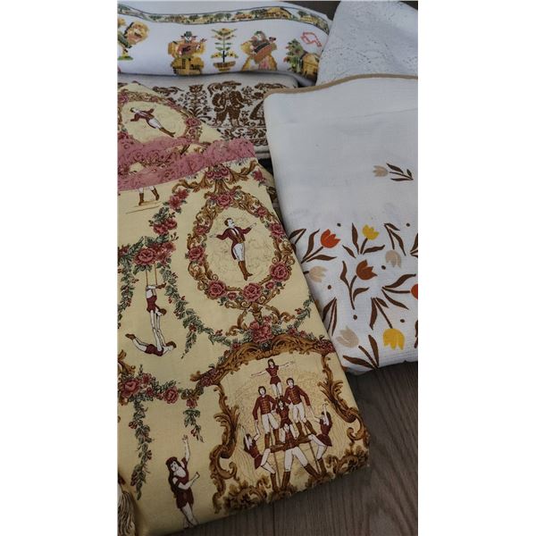 Decorative Table Linens Including Lace Tablecloth and Printed Fabric Runners