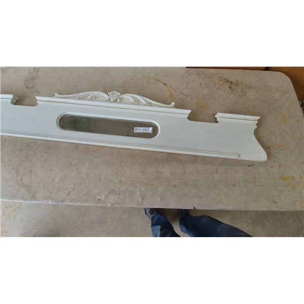White Painted Wood Fireplace Mantel with Mirror and Carved Details