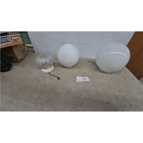 Three White Glass Light Fixtures: One Large Globe, One Hobnail Oval, and One Small Globe