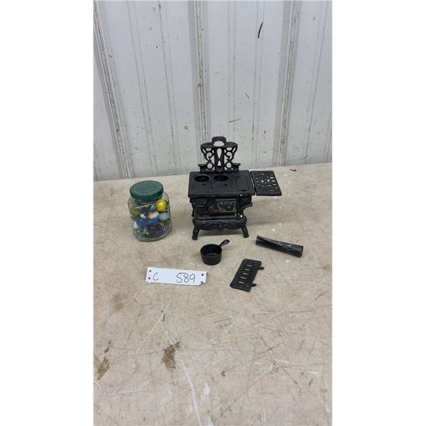Miniature Crescent Cast Iron Toy Stove With Accessories and Jar of Marbles