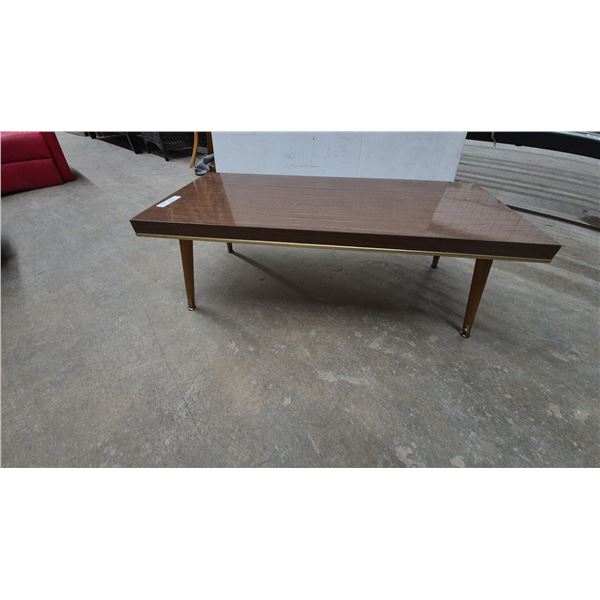 Mid-Century Modern Coffee Table with Tapered Legs and Brass Accents. 13”×19”×40”