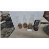 Image 1 : Four Oil Lamps: Two Copper-Toned, One Brass-Toned, and One Wall-Mountable with Iron Base