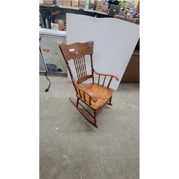 Carved Wood Rocking Chair with Spindle Back and Arms