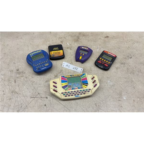 Radica Solitaire, 3-Line Slot, Pocket Slot, MB Yahtzee and Tiger Wheel of Fortune Handheld Games