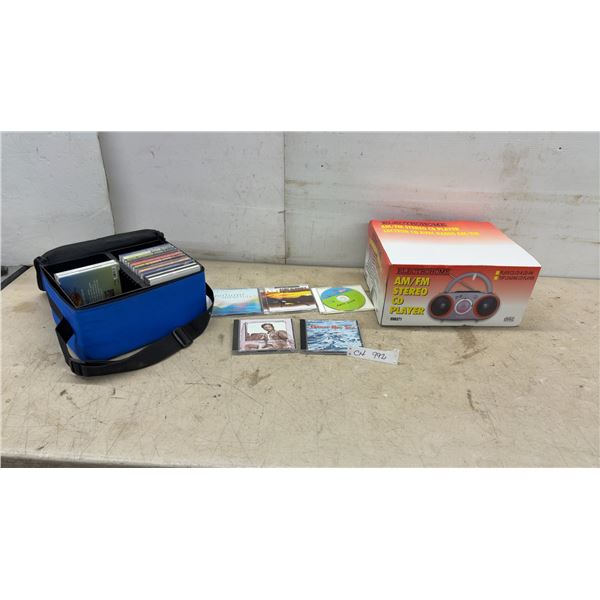 New Electrohome EH8371 AM/FM Stereo CD Player with Blue Carrying Case and Assorted Music CDs