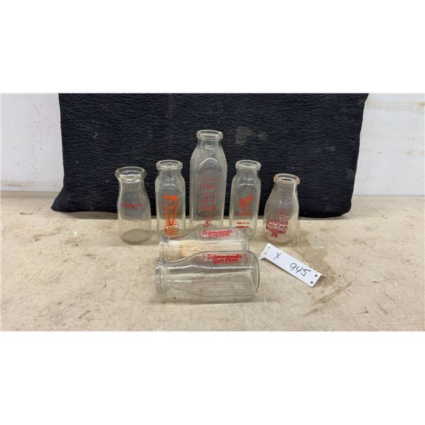 Seven Vintage Glass Milk Bottles Including Silverwood's, Stacey Bros., Wilson's, Page's