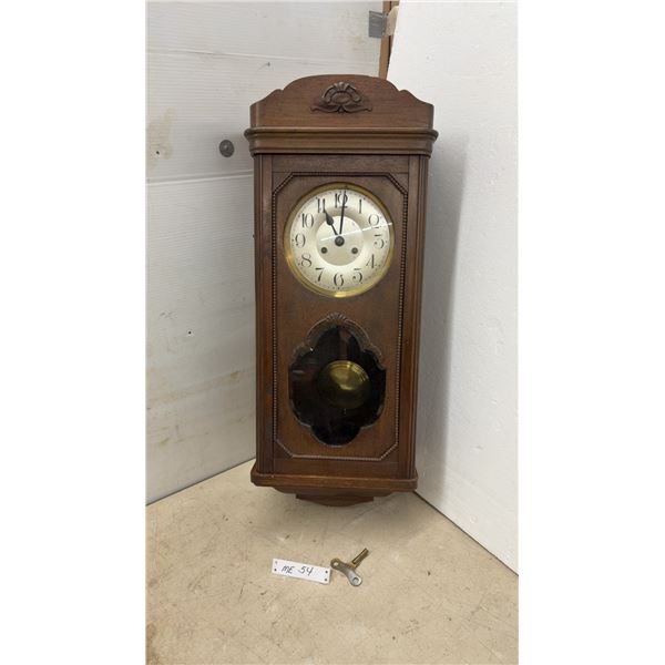 Antique Carved Wood Wall-Mounted Pendulum Chime Clock with Key, Early 20th Century, 32 × 13”