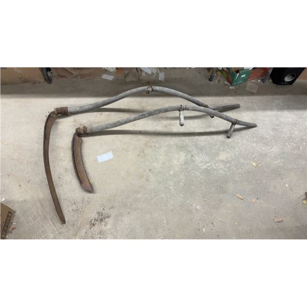Pair of Vintage Hand Scythes with Curved Wooden Snaths and Rusted Metal Blades