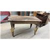Image 1 : Antique Wooden Table with Turned Legs and Yellow-Painted Metal Leg Extenders on Casters
