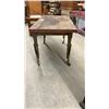 Image 2 : Antique Wooden Table with Turned Legs and Yellow-Painted Metal Leg Extenders on Casters
