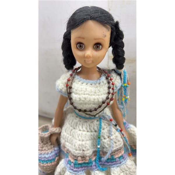 Pair of Vintage Native American Dolls with Crocheted Attire and Feathered Headdress, Tallest 16”