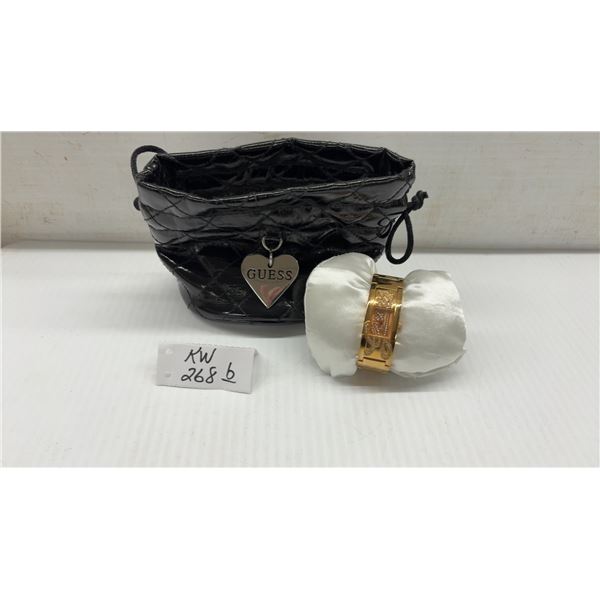 Guess Women's Gold-Tone Wristwatch Model W12097L1 with Crystal Scrollwork and Pouch