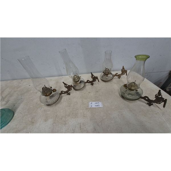 Four Wall-Mount Kerosene Lamps with Glass Chimneys and Ornate Cast Iron Brackets