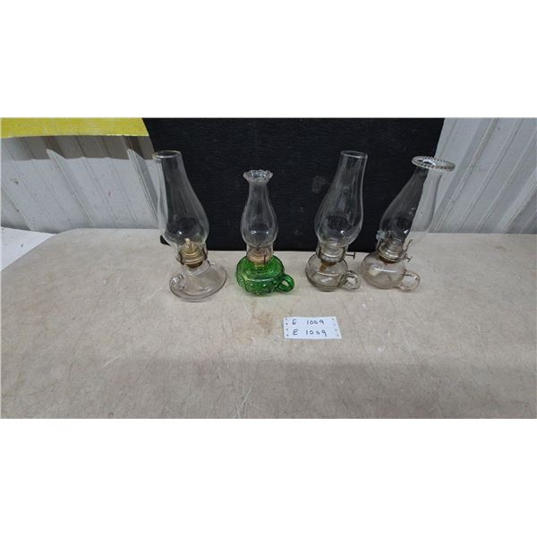 Four Vintage Oil Lamps Including Green Moon and Stars and Clear Glass Finger Lamps