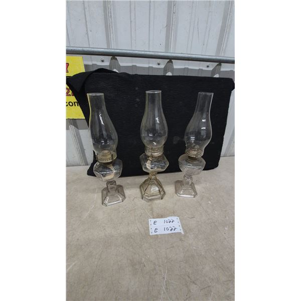Three Clear Glass Oil Lamps with Chimneys and Wicks