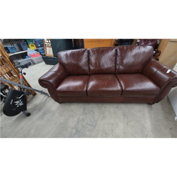 Three-Seater Brown Leather Sofa with Rolled Arms and Nailhead Trim. 88” wide