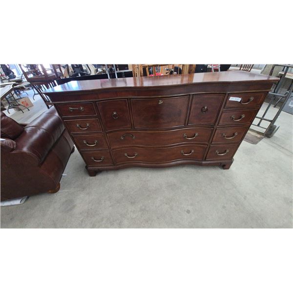 Traditional Dark Wood Serpentine Front Dresser with Oval Inlay and Multiple Drawers. 38”×70”×20”