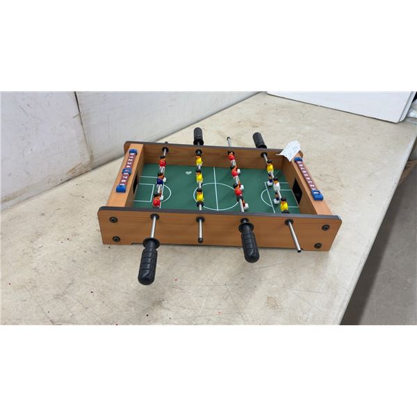Miniature Tabletop Foosball Game with Wooden Frame, Red and Yellow Teams, and Score Counters