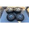Image 1 : 4 Staggered Chevy 5 Bolt Rims with Rings and Centre Caps: 2 14” Rims on 205/70R14 Tires and 2 15”