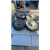 Image 1 : 4 15” 5 Bolt Steel Rims with Mixed Tires: Bridgestone 235/75R15, Bridgestone 225/75R15