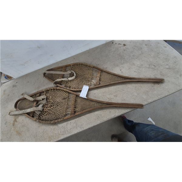 Pair of Antique Huron Teardrop Wooden Snowshoes with Rawhide Lacing and Fabric Bindings