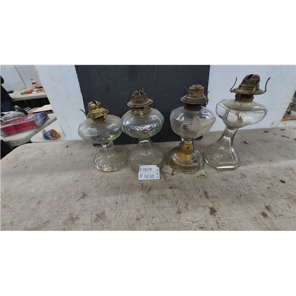 Four Antique Clear Glass Kerosene Oil Lamps with Pedestal Bases and Metal Wick Burners