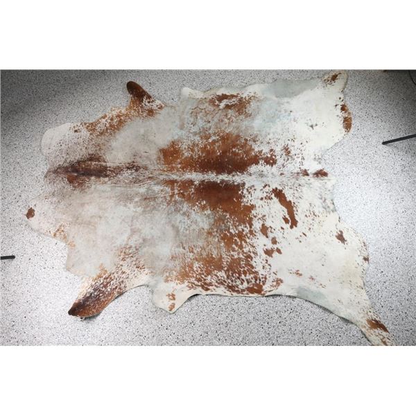 Brown and White Cowhide Rug