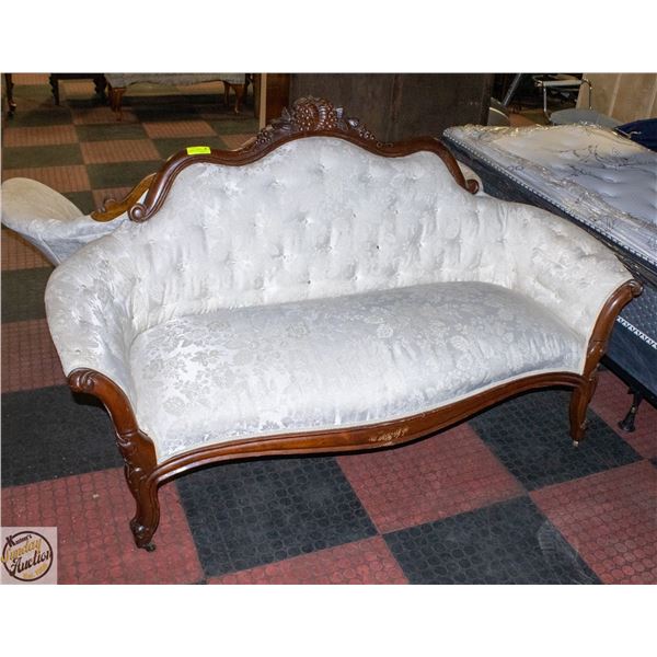 VICTORIAN STYLE SETTEE WITH ORNATE DARK WOOD FRAME
