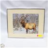 Image 1 : BULL ELK STANDING IN A SNOWY WINTER FOREST