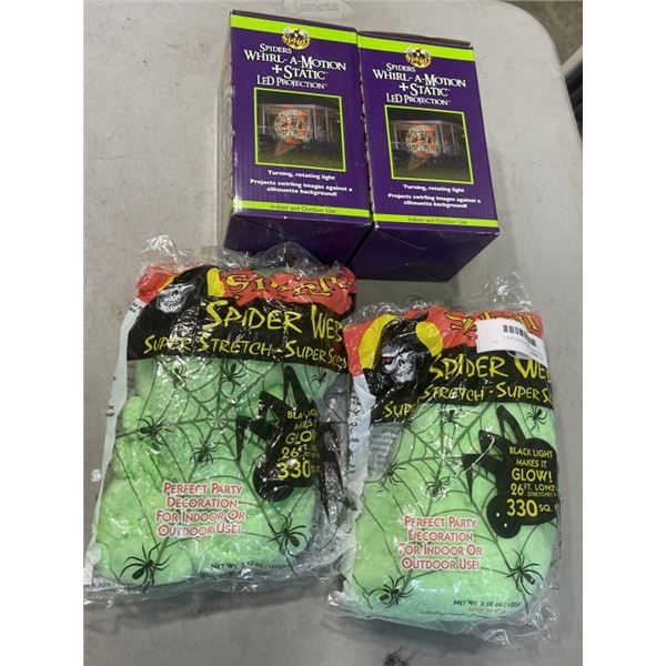 2 HALLOWEEN  MOTION LIGHTS AND 2 BAGS OF GREEN WEBBING