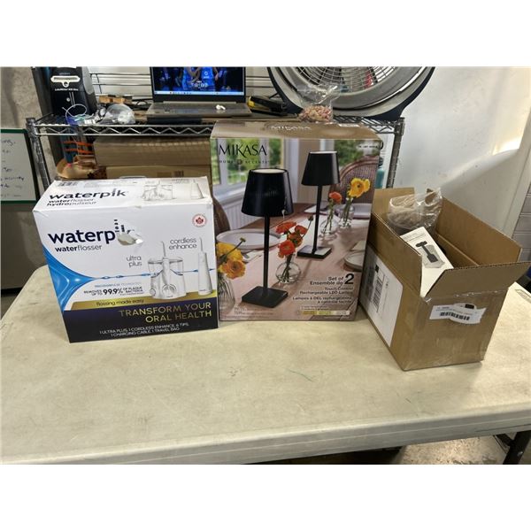 ASSORTED STORE RETURNS. 1 MIKASA TOUCH CONTROL RECHARGABLE LED LAMP. NOT A SET OF 2, WATERPIK WATER 